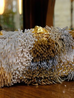 LUSH-GOLD-BOX-CLUTCH-ON-MODEL.jpg